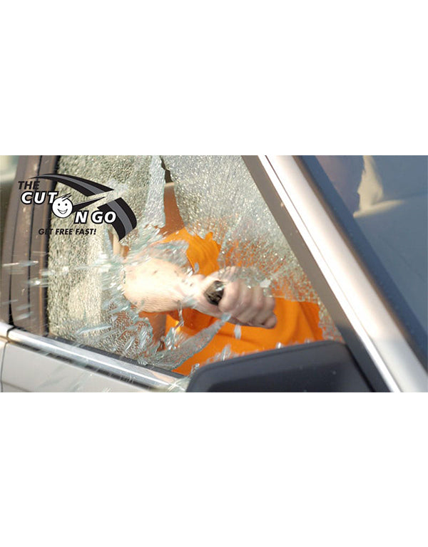 Person using a tool to break a car window with 'The Cut-Off NGO' logo visible.